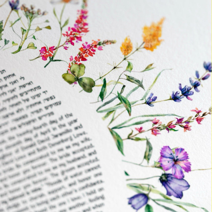 Detail of colorful watercolor wildflowers on the Spring Flowers Ketubah surrounding the Jewish wedding contract.